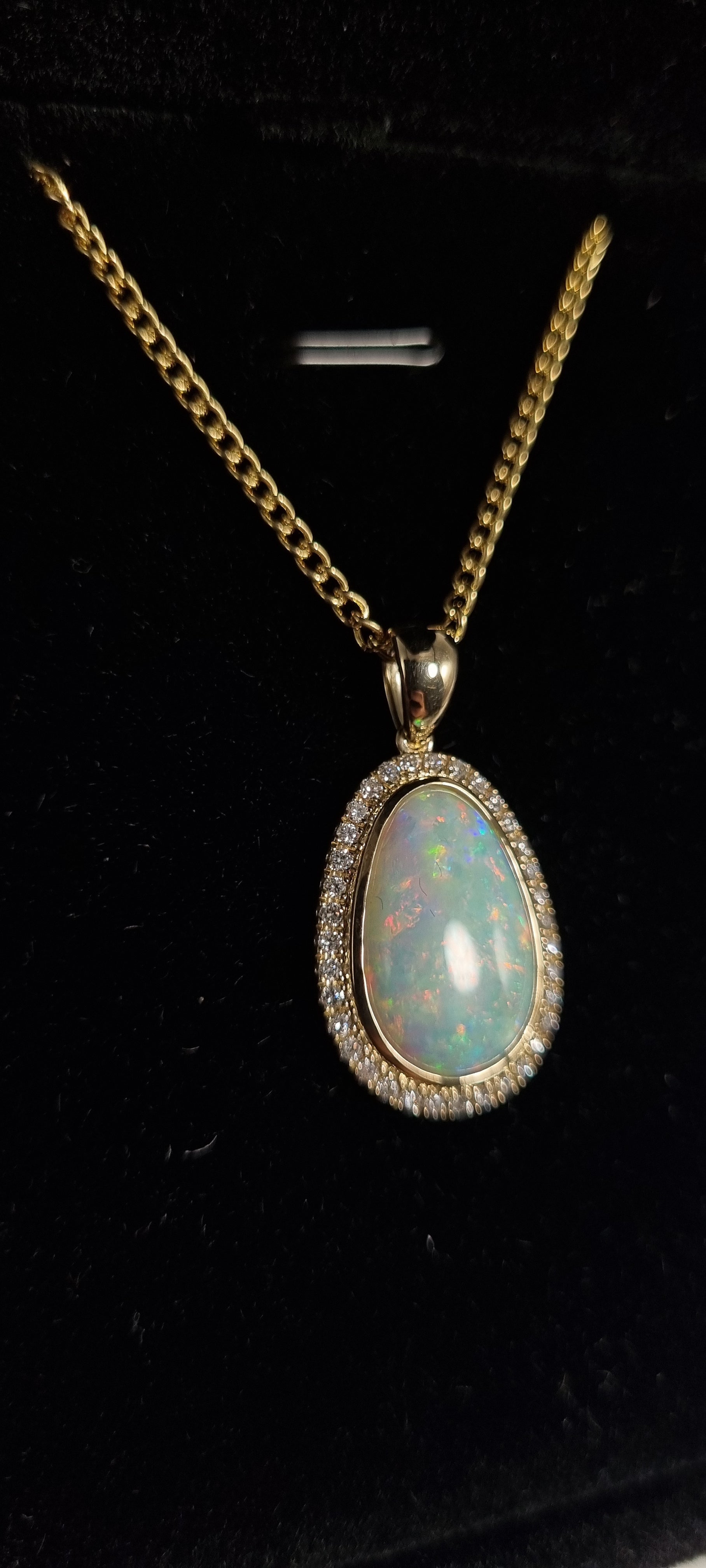 5.5ct Solid Opal in 9k Gold w/Zirconia