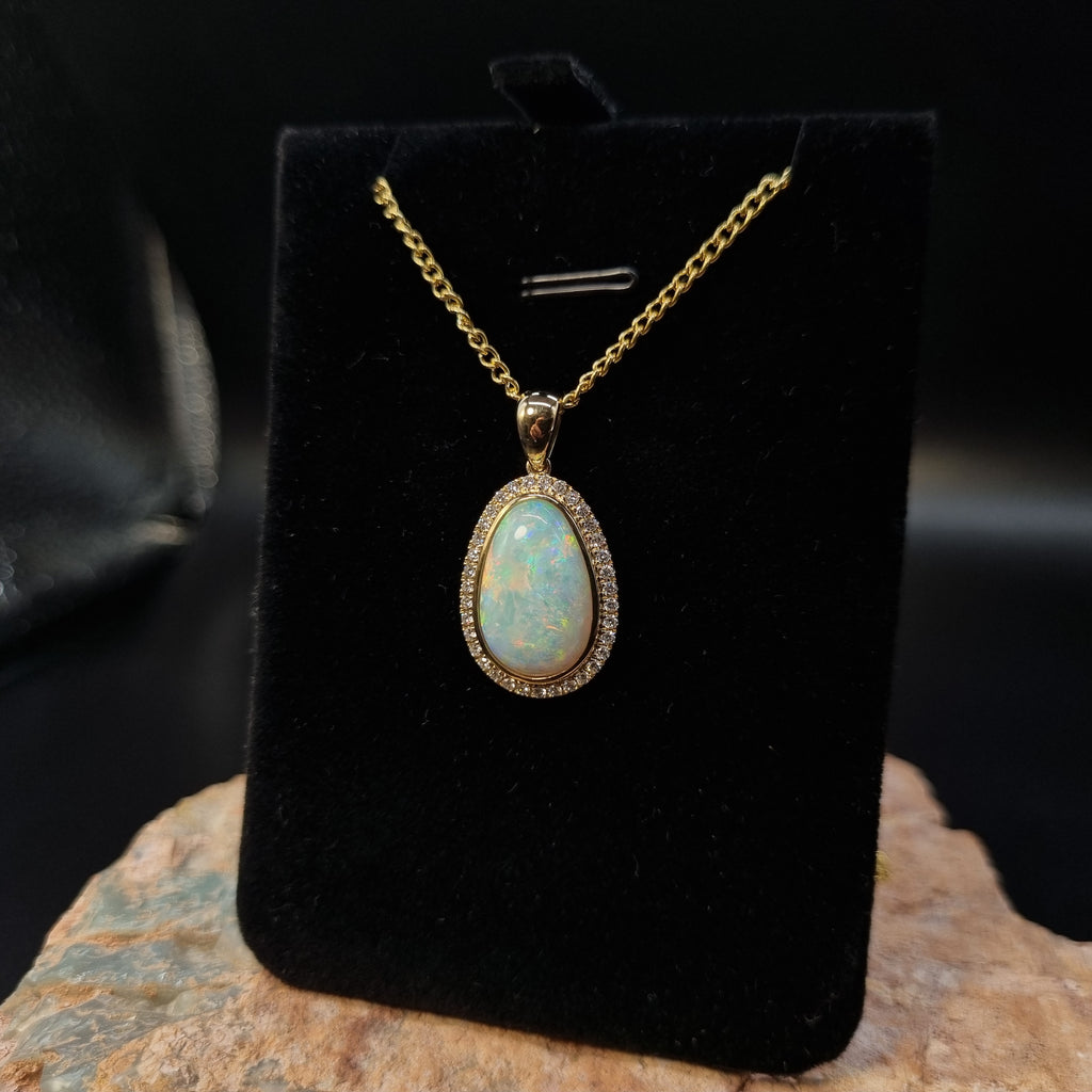 5.5ct Solid Opal in 9k Gold w/Zirconia