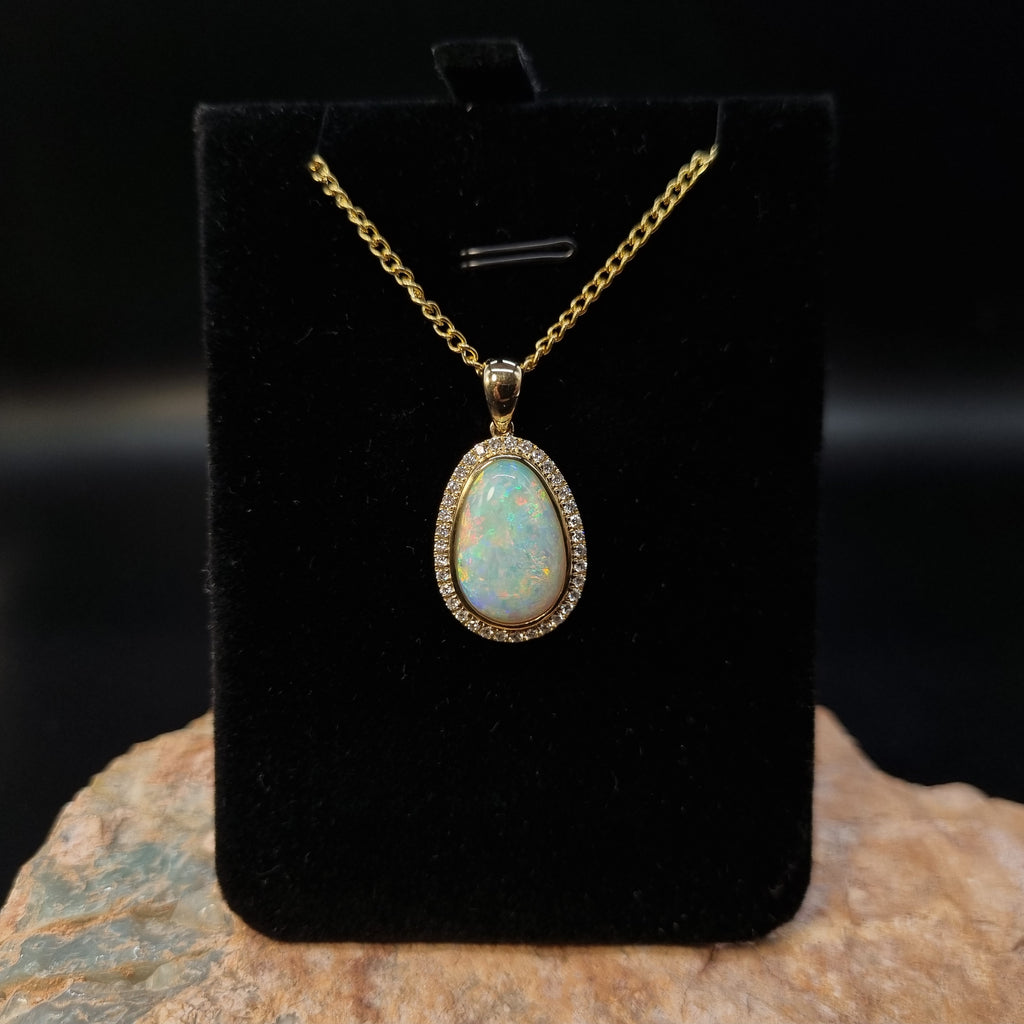 5.5ct Solid Opal in 9k Gold w/Zirconia