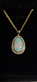 5.5ct Solid Opal in 9k Gold w/Zirconia